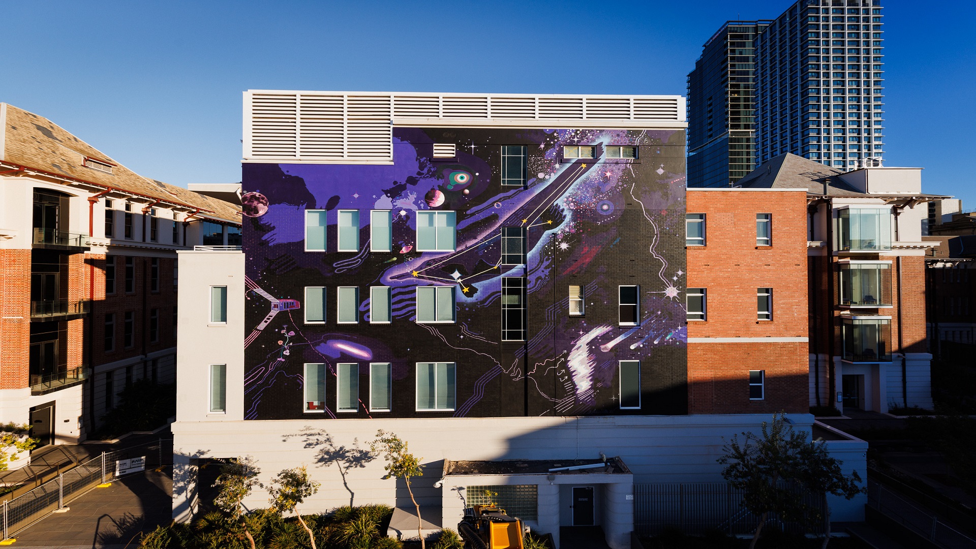 A view of a space-themed mural on a building