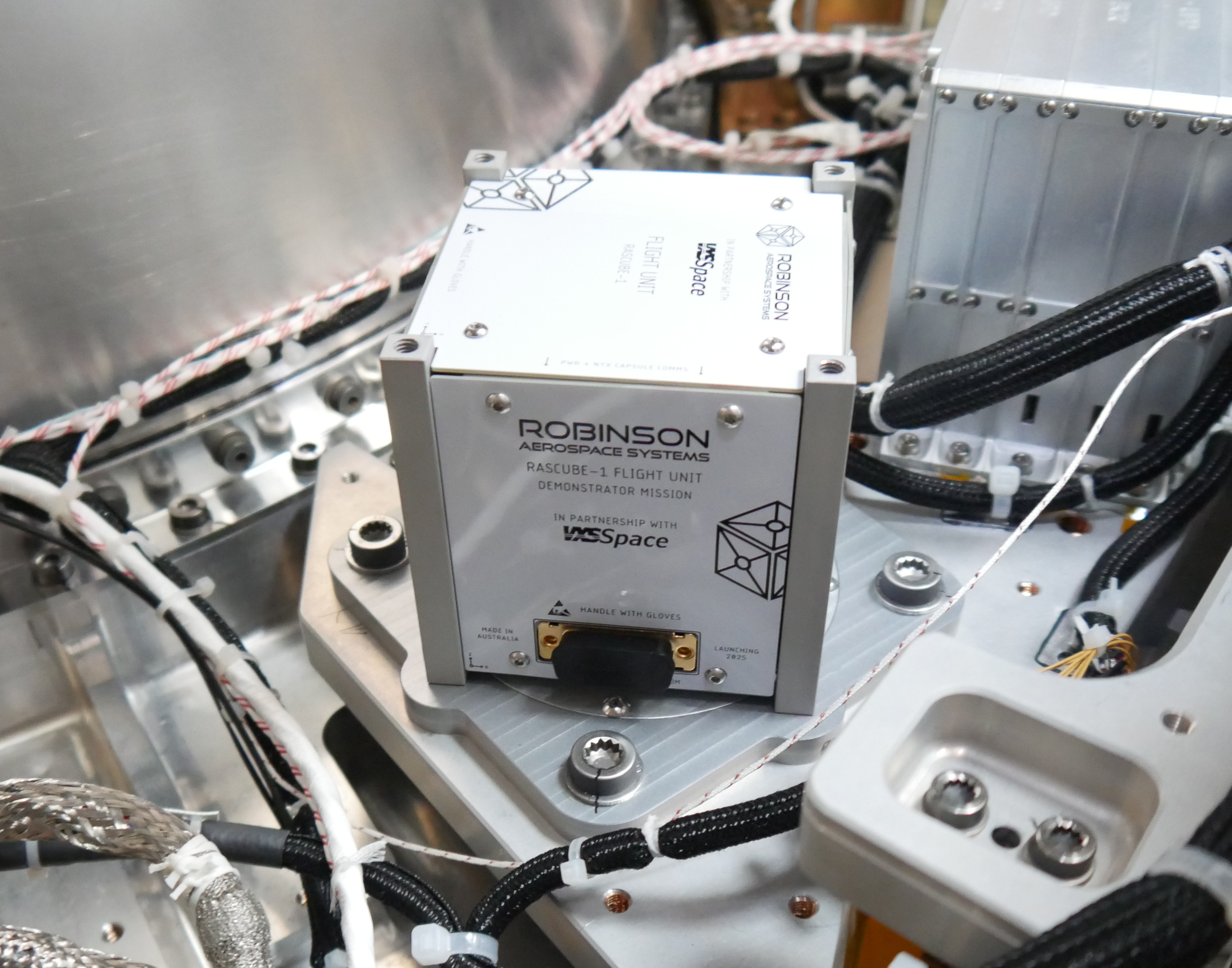 RASCube-1, our first real payload, mounted to the space capsule ahead of it’s first launch.