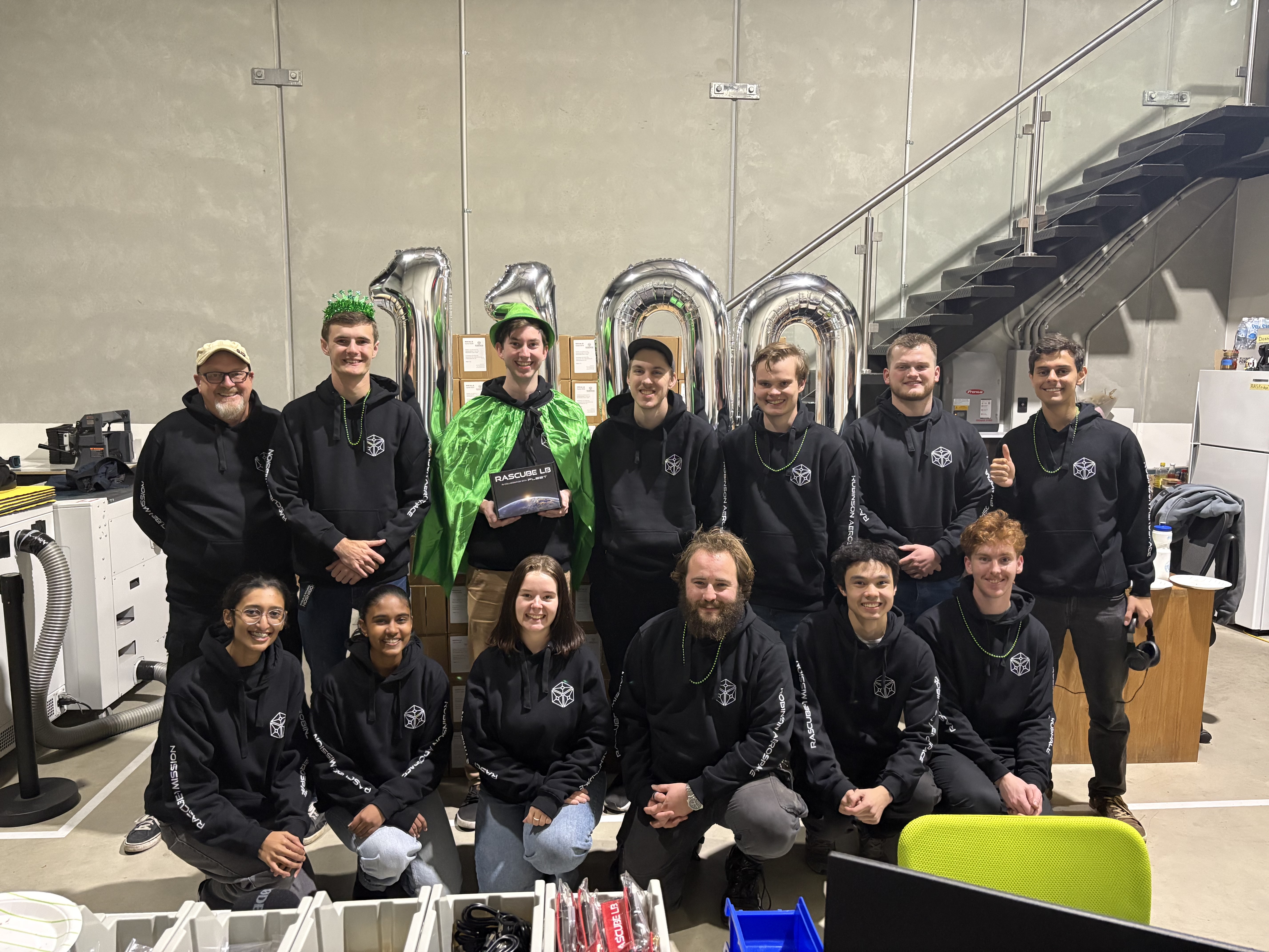 The Robinson Aerospace Adelaide team celebrating RASCube serial number 1000 rolling off our local production line.