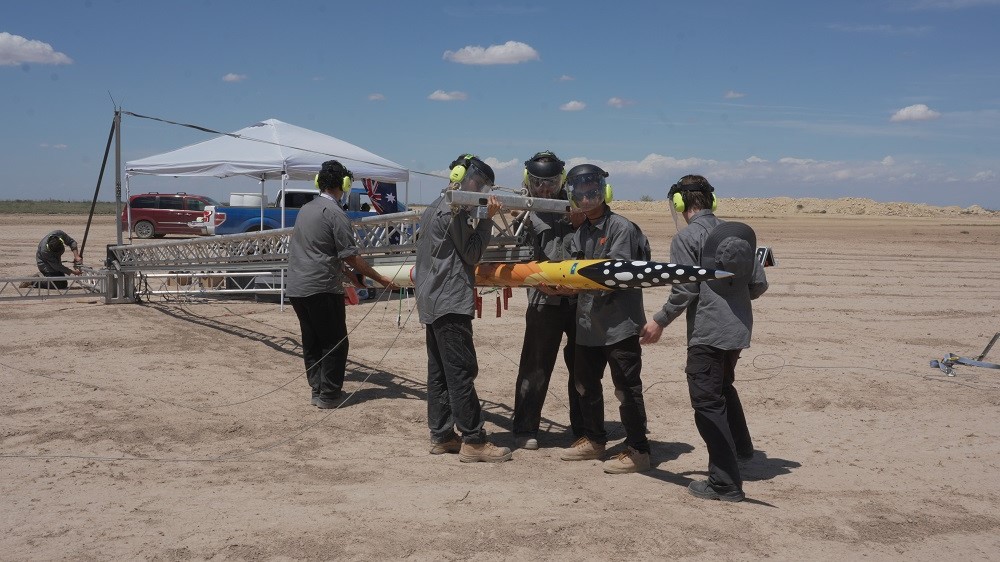 A group of students working on their high power rocket project