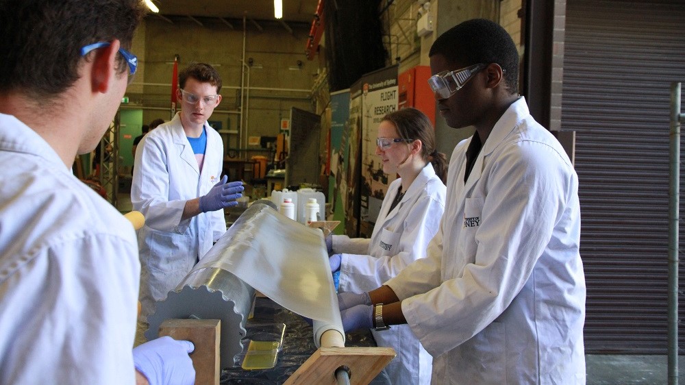 A group of students working on their high power rocket project