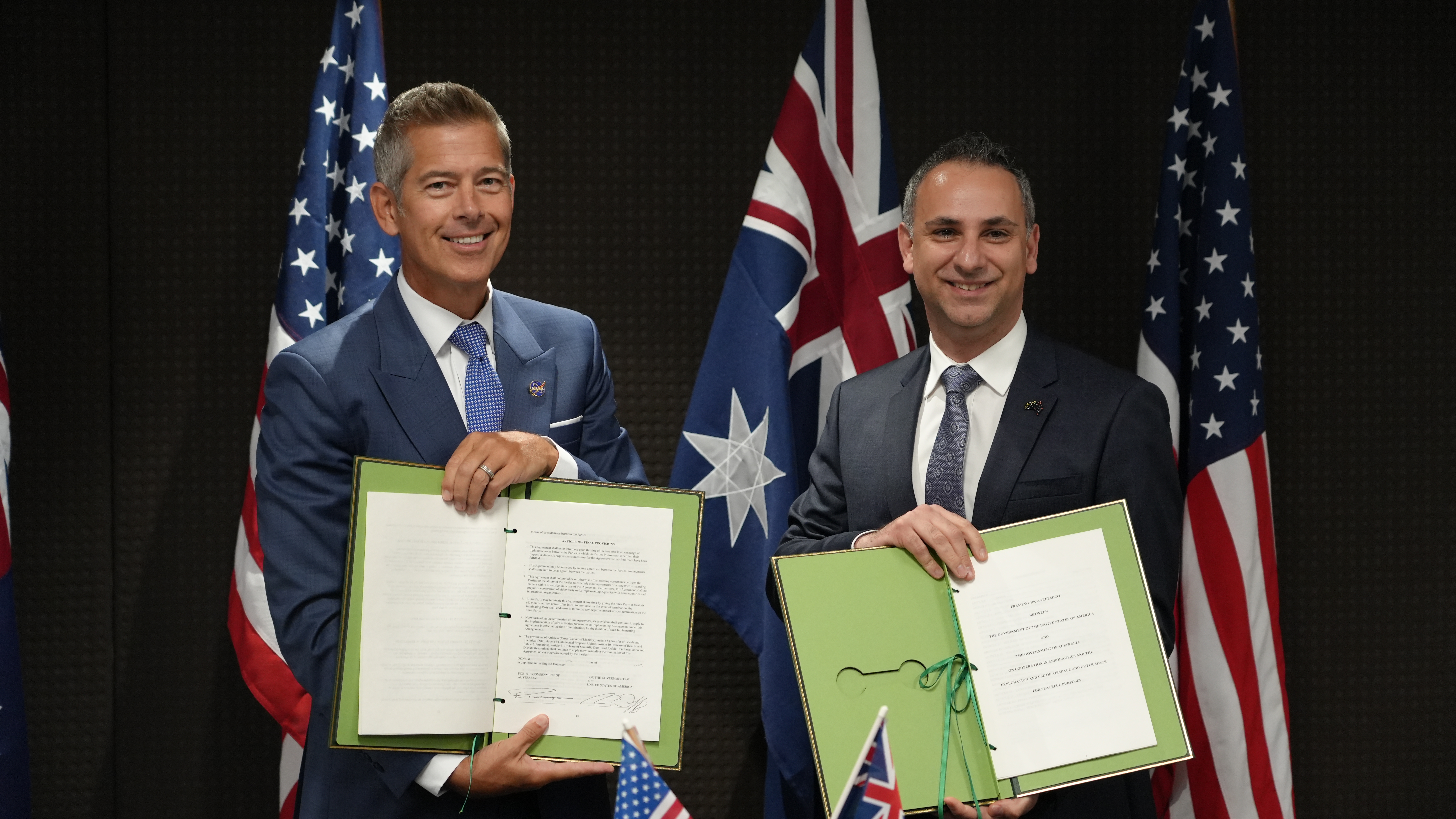 Sean Duffy, NASA's acting administrator and Head of the Australian Space Agency Enrico Palermo signing the landmark US-AU Space Framework Agreement.