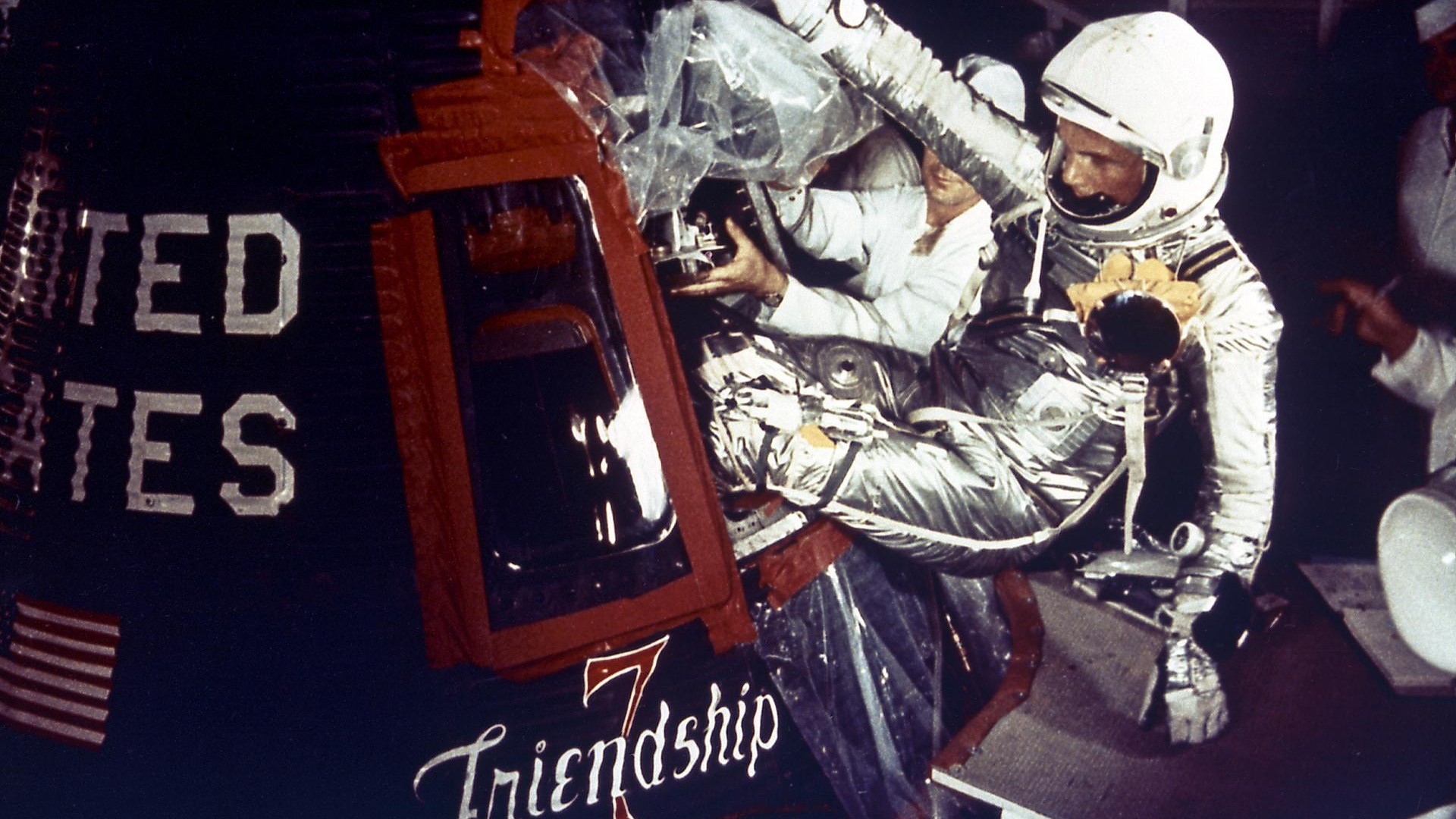 Astronaut John Glenn enters the Mercury spacecraft, Friendship 7, prior to the launch of MA-6 on February 20, 1961 and became the first American who orbited the Earth. 