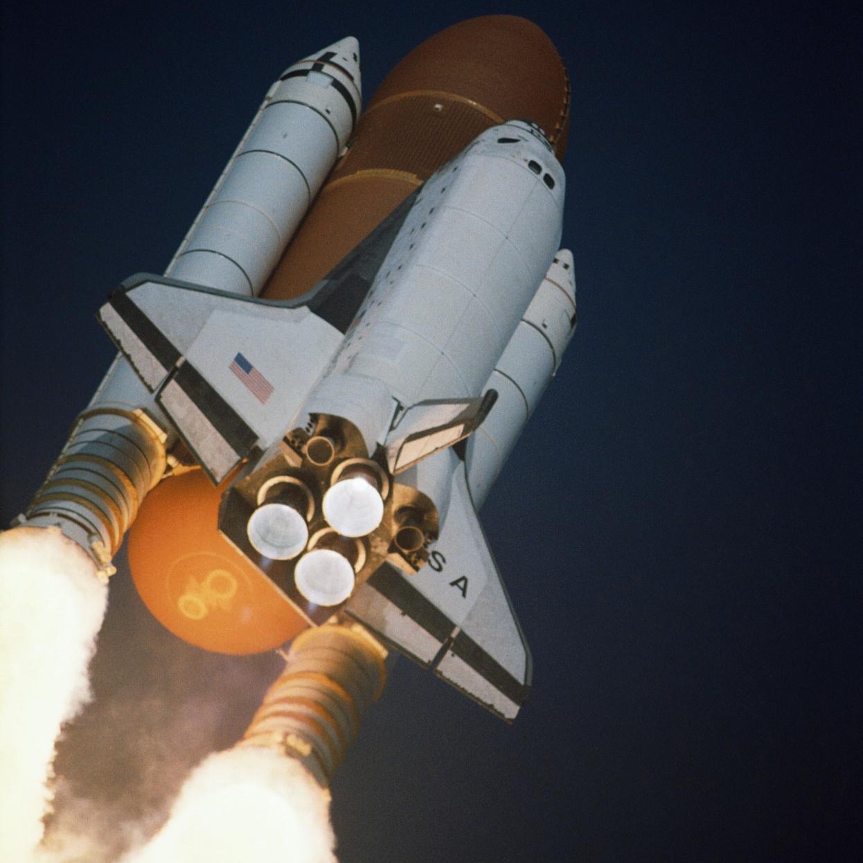 The Space Shuttle climbs to orbit. This view from below shows the combination of liquid-fuelled main engines and Solid Rocket Boosters that powered the launch. Credit: NASA