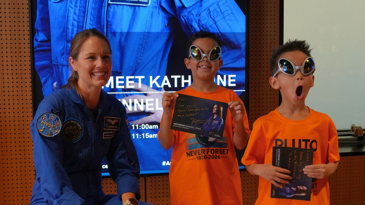 Australian astronaut Katherine Bennell-Pegg with young space enthusiasts at an event.