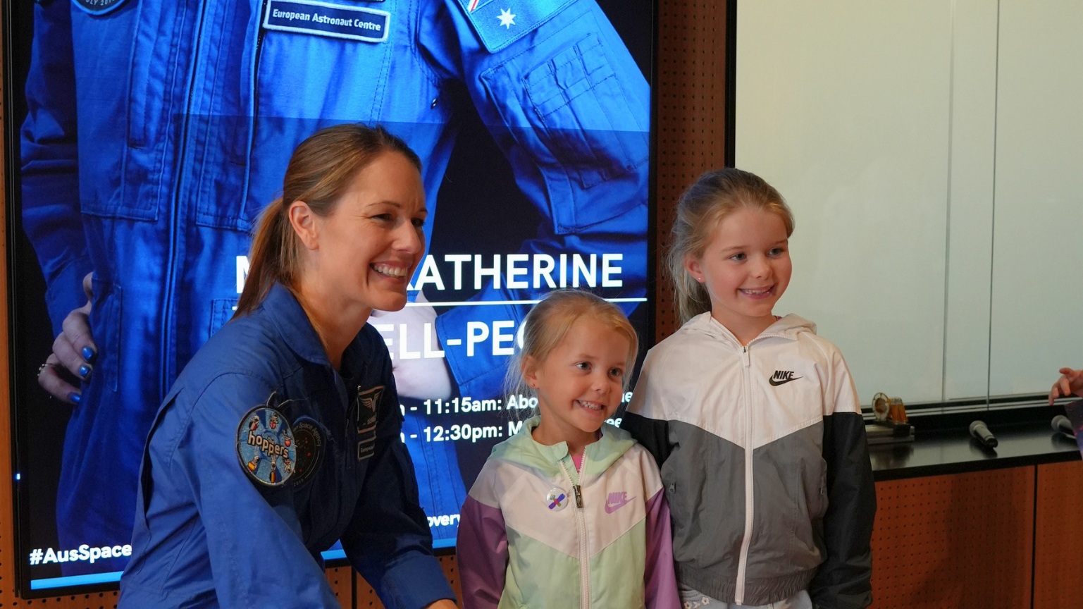 Australian astronaut Katherine Bennell-Pegg with young space enthusiasts at an event.