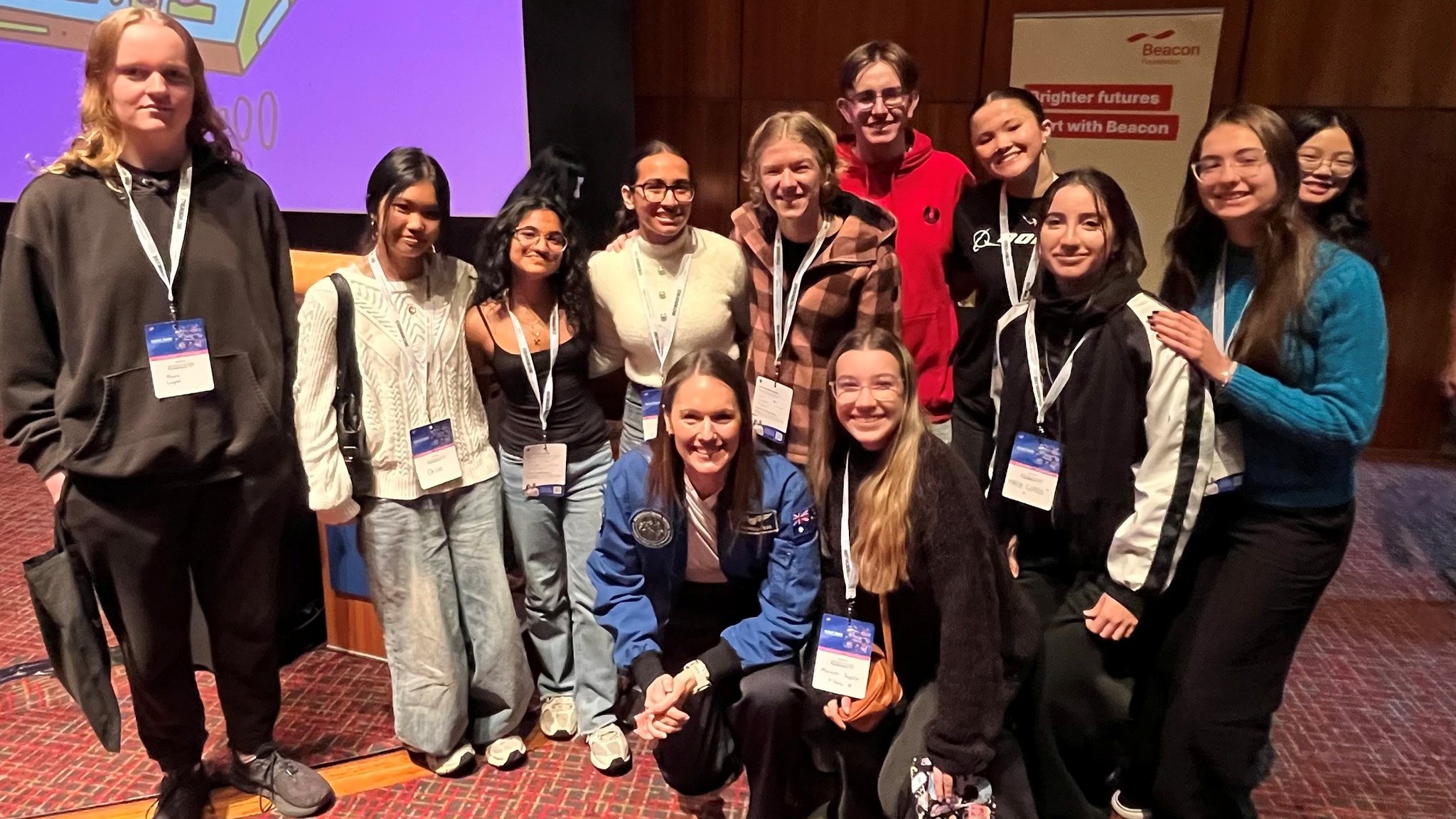 Australian astronaut Katherine Bennell-Pegg with a group of students at an event in Tasmania