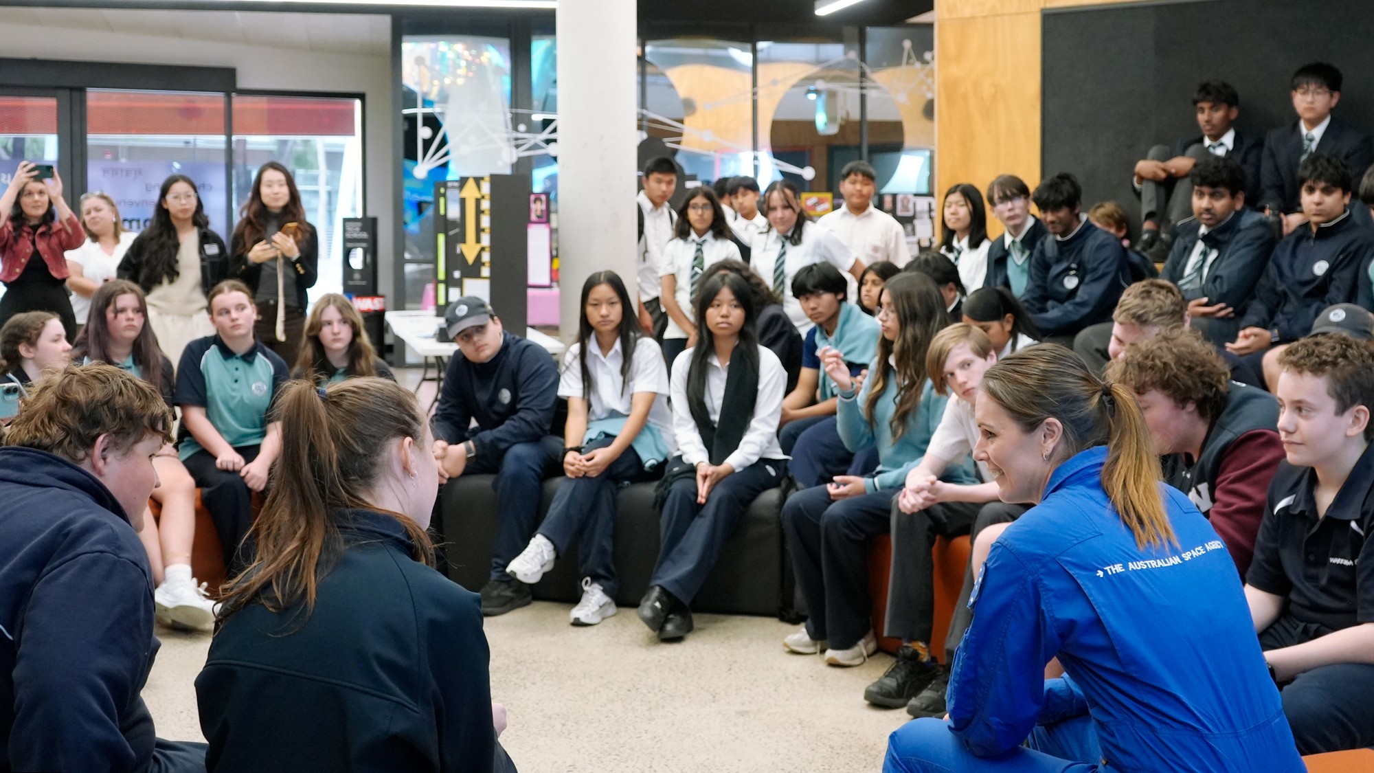 Australian astronaut Katherine Bennell-Pegg with students from a Melbourne school