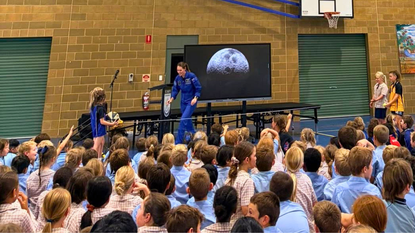 Australian astronaut Katherine Bennell-Pegg with school students at an event in Charlesville, regional Queensland.