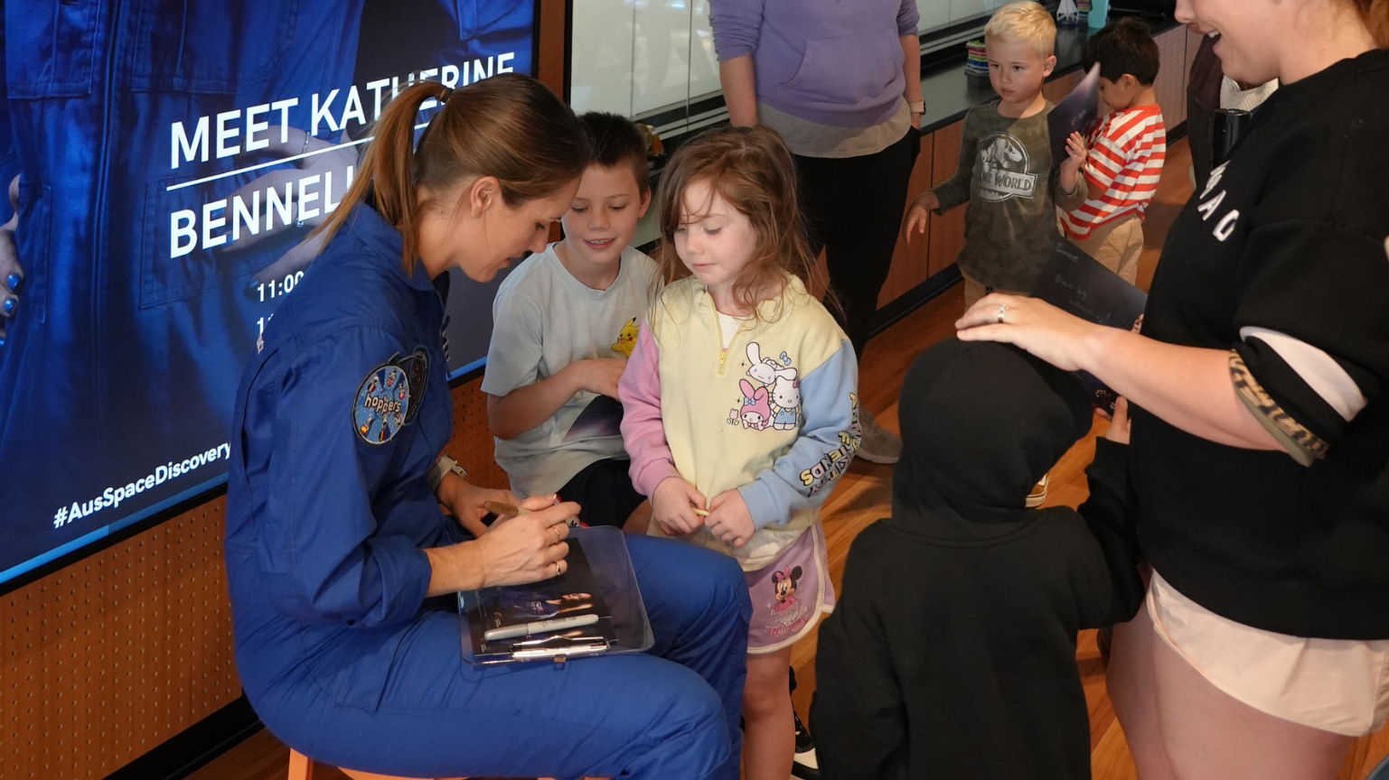 Australian astronaut Katherine Bennell-Pegg with young space enthusiasts at an event.