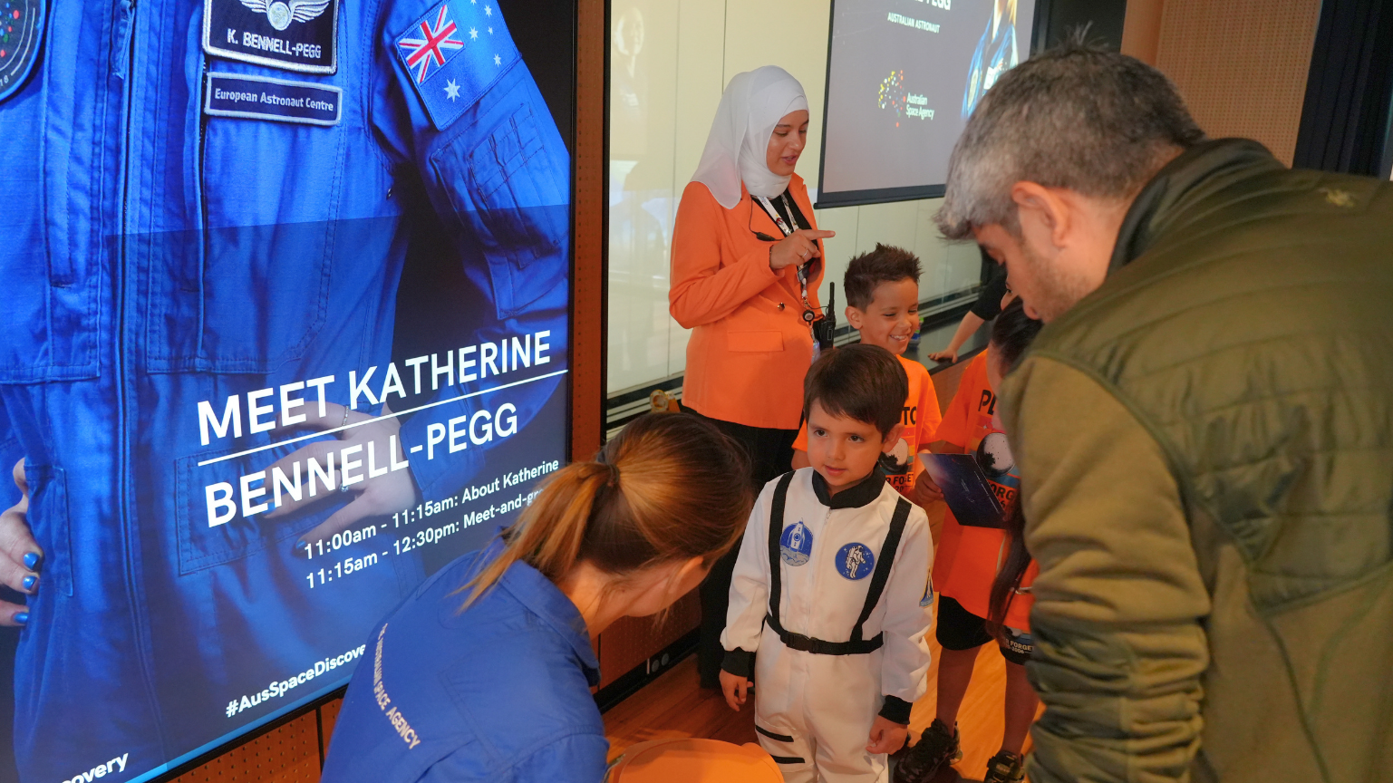 Australian astronaut Katherine Bennell-Pegg with young space enthusiasts at an event.