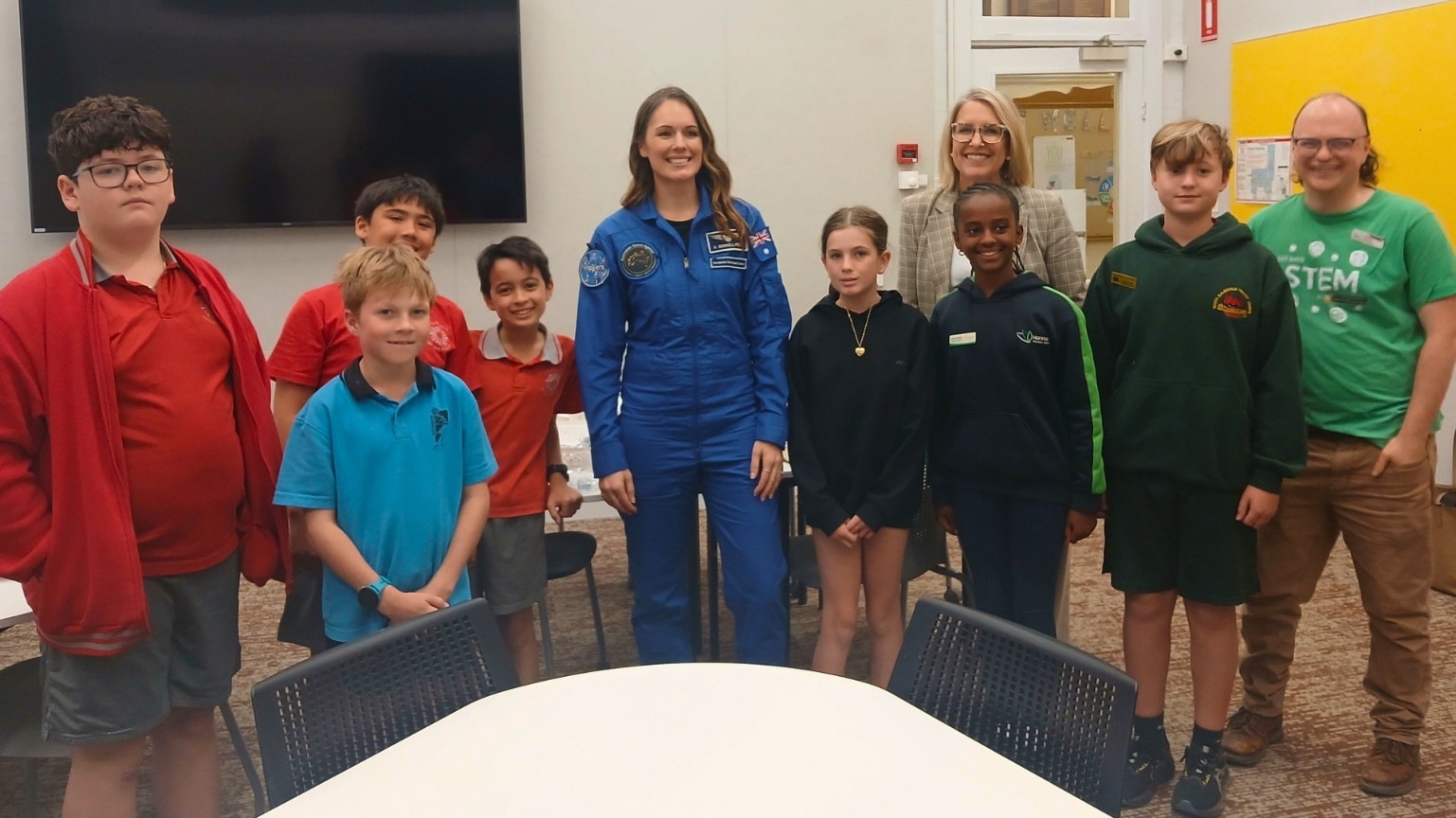 Australian astronaut Katherine Bennell-Pegg with young space enthusiasts at an event.