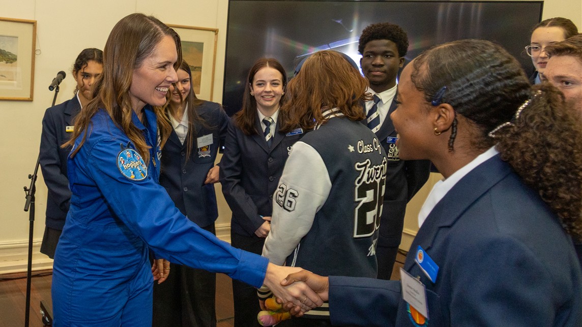 Australian astronaut Katherine Bennell-Pegg with young space enthusiasts at an event.