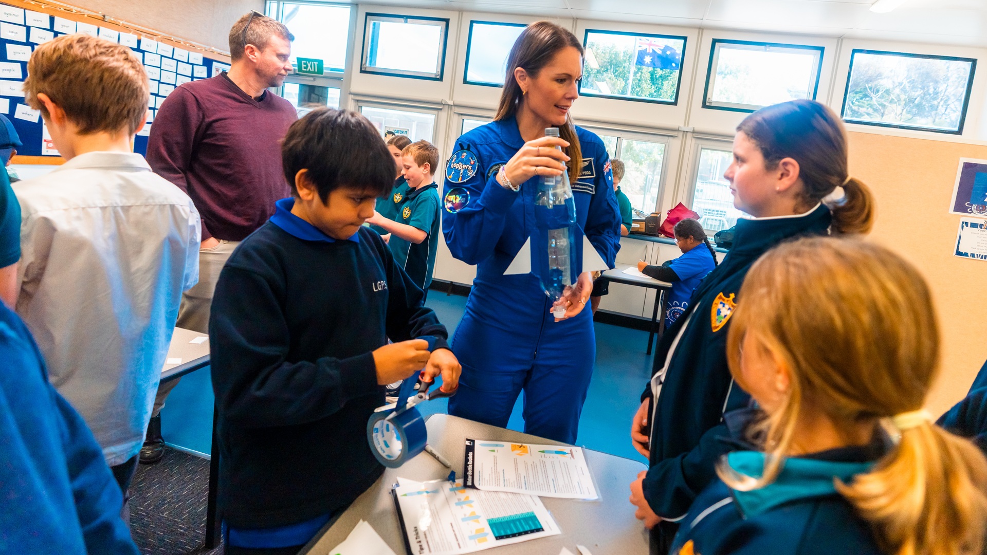 Australian astronaut Katherine Bennell-Pegg with young space enthusiasts at a school in regional South Australia.  Credit: Jaimie Wearne