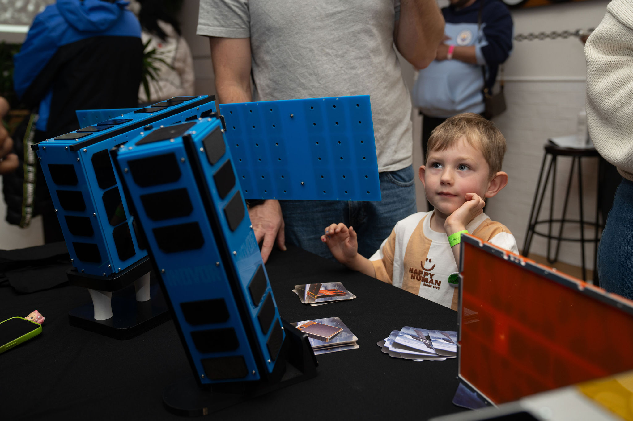 Space enthusiasts at Space Day Out 2026 seeing up close a locally built satellite.