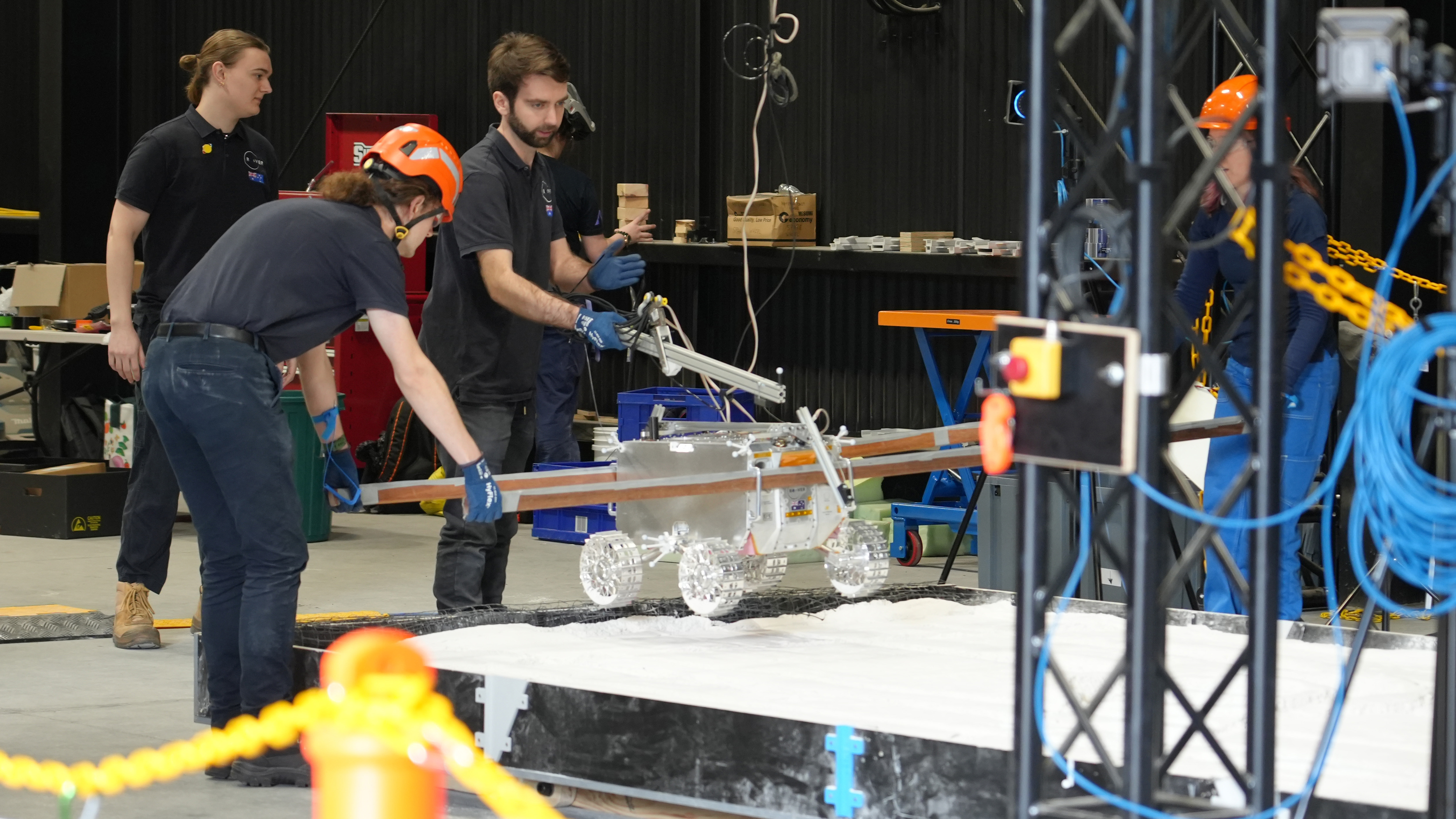 a new Roo-ver prototype that is Developed by the ELO2 consortium in partnership with the Australian Space Agency is being tested at Adelaide University's EXTERRES CRATER Facility