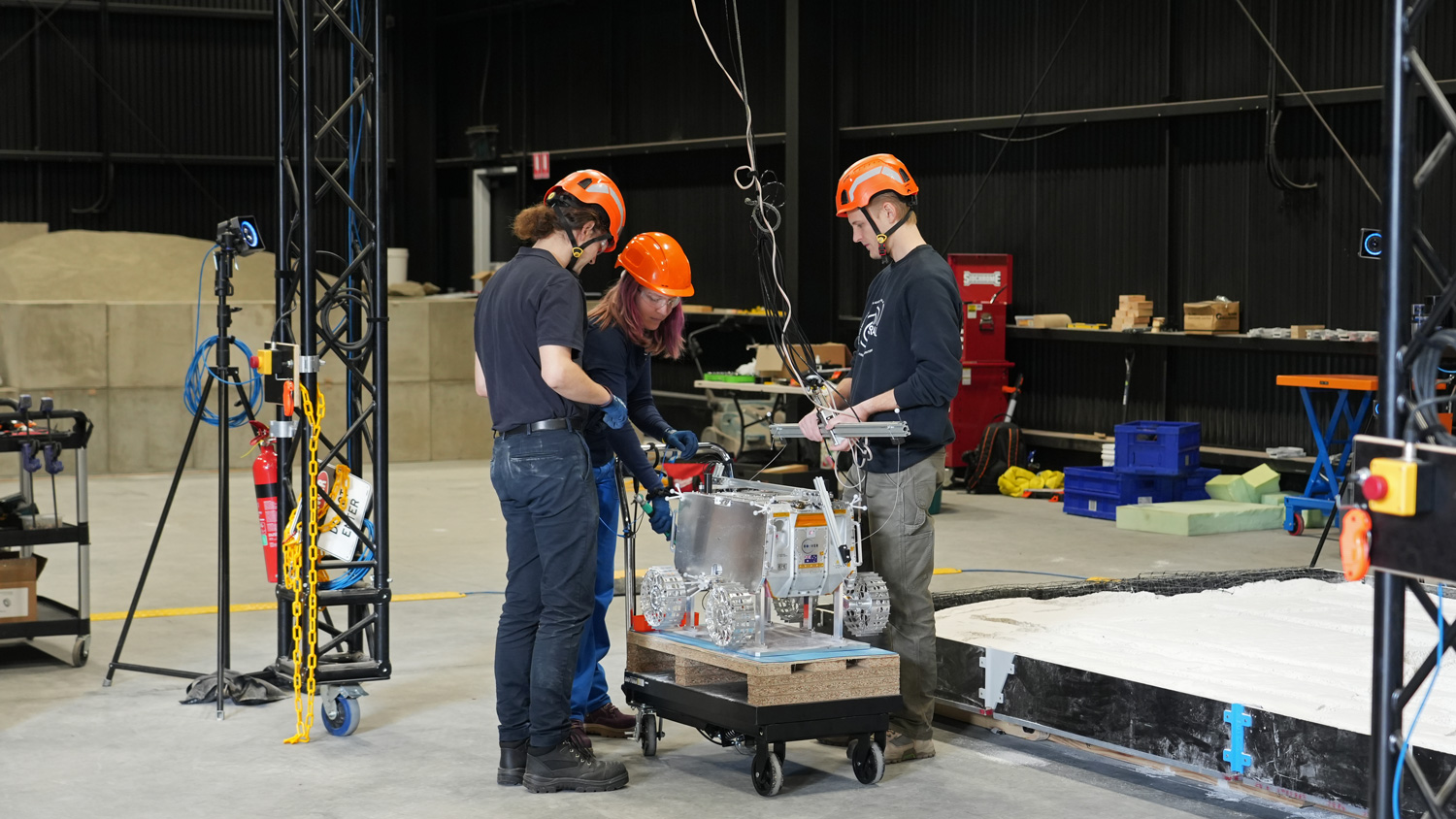 The ATCSR team connecting the prototype to the gravity offload system.