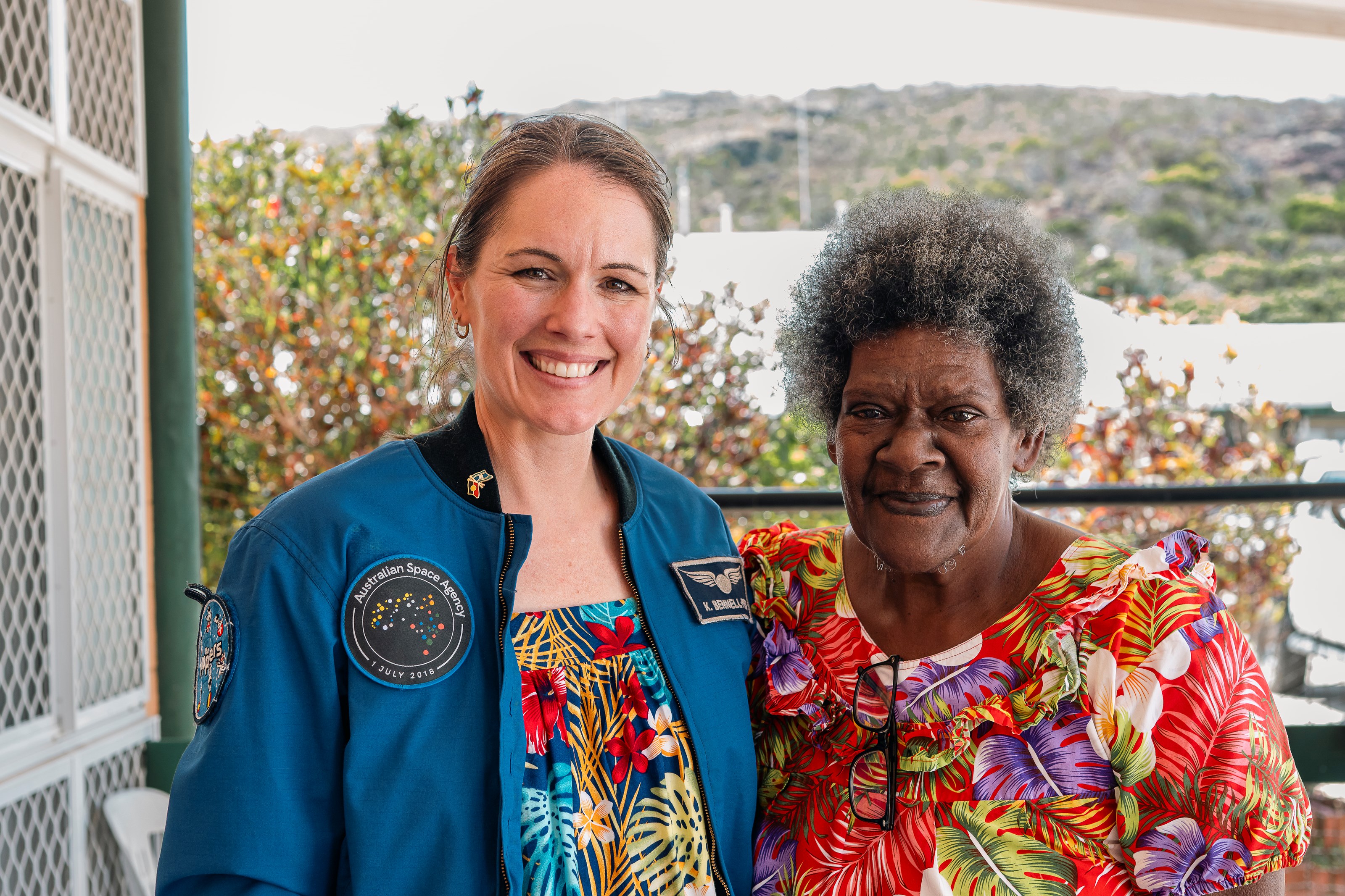 Aussie astronaut Katherine Bennell-Pegg observing the exhibits with the local community in the Torres Strait