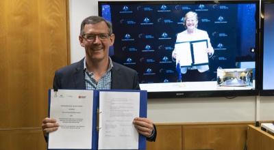 Chief Minister of the Northern Territory Hon Michael Gunner and Dr Megan Clark AC present signed agreement