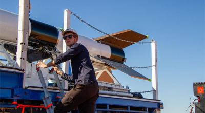 Photo of Nick McLean, Propulsion Engineer, working on a rocket.