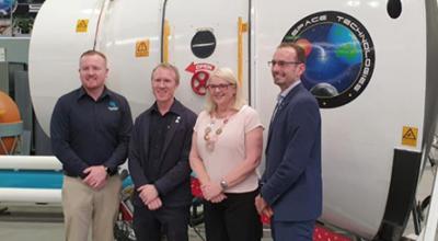 James Gilmour and Adam Gilmour, Gilmour Space; Minister Karen Andrews; Anthony Murfett, Deputy Head Australian Space Agency stand in front of space capsule