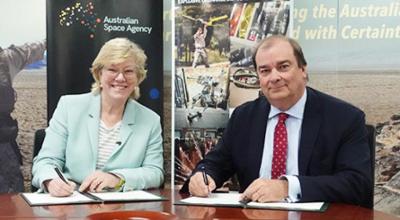 Photo of Dr Megan Clark AC and Mr Philippe Odouard, Managing Director of XTEK signing papers.