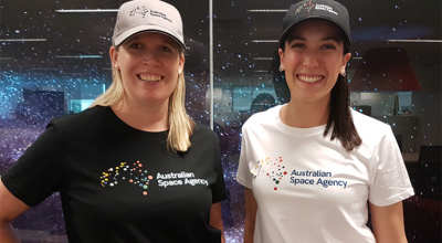 Photo of two women wearing Australian Space Agency t-shirt featuring the brand
