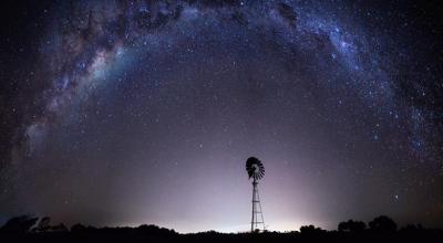 Purple night sky with stars showing the Milky Way from outback Australia. 