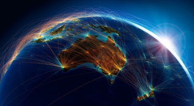 Image of Australia from space with beams of light connecting across continents.