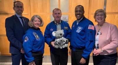 The Australian Space Agency team holding the stuffed toy koala and joey in the Australian Space Agency foyer.
