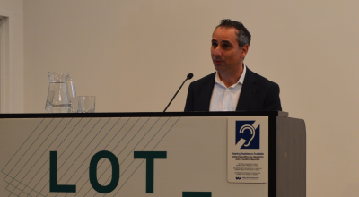 Person's speaking from the podium at an event.
