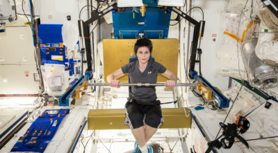 person in microgravity exercising