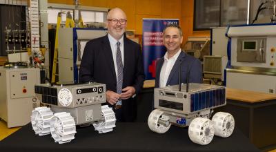 Minister for Industry and Innovation and Minister for Science Tim Ayres along with Head of the Australian Space Agency Enrico Palermo and two prototypes of Australia's lunar rover.