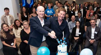 David Haley (left) and CEO Ben Cade cut 10th birthday cake