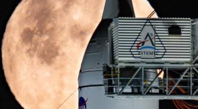 A full Moon is seen shining over NASA’s SLS (Space Launch System) and Orion spacecraft, atop the mobile launcher in the early hours of February 1, 2026. 