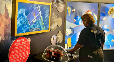 A visitor interacting with the Buccaneer exhibit at the Australian Space Discovery Centre
