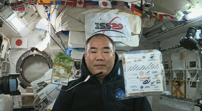A banner to promote the Space Harvest initiative with an astronaut A banner to promote the Space Harvest initiative with JAXA astronaut Soichi Nouchi