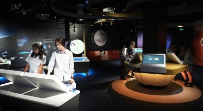 School students interacting with exhibits at the Australian Space Discovery Centre