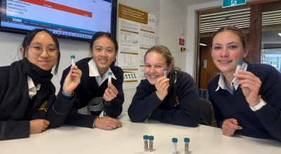 Four young female Australian school students showing Mission Sprout kits. Credit Sara Webb