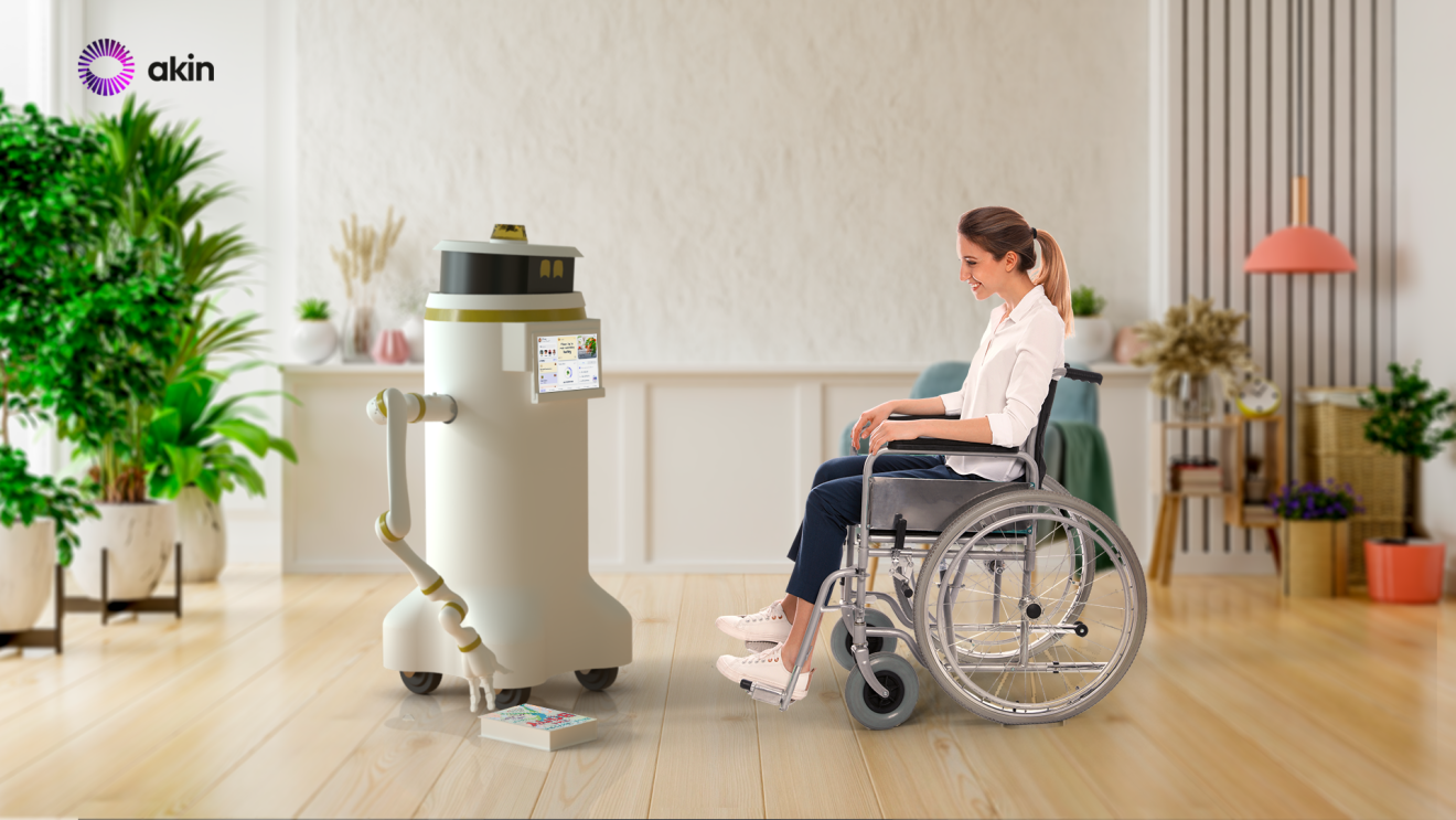 aKin's robot called 'Murphy', assisting a person at home to access a book on the floor using a robotic arm. 