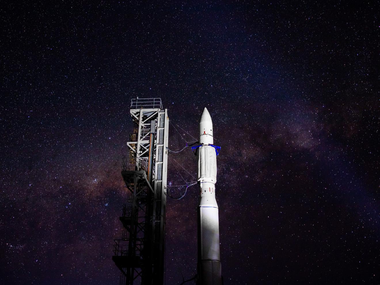 Rocket on launch pad at night 