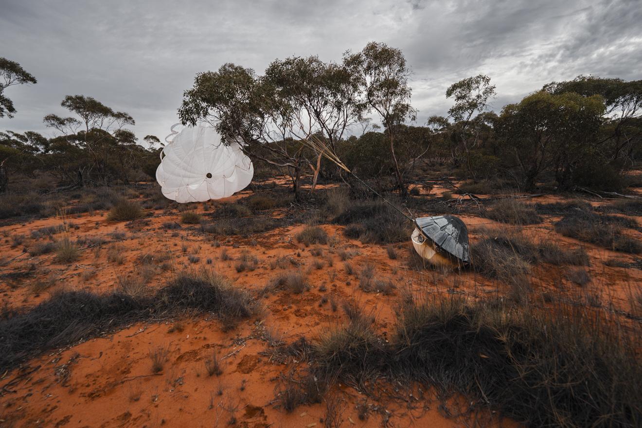 An image a capsule after landing on Earth from orbit