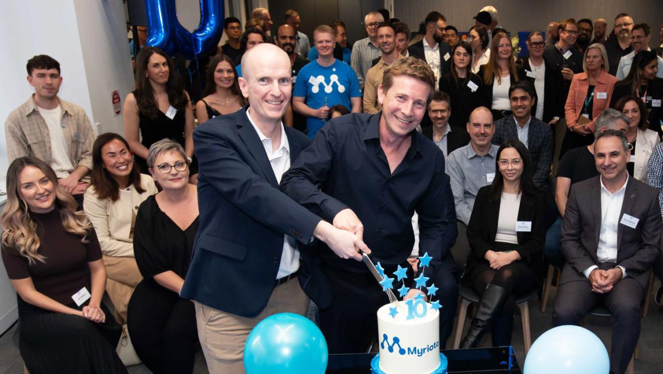 David Haley (left) and CEO Ben Cade cut 10th birthday cake