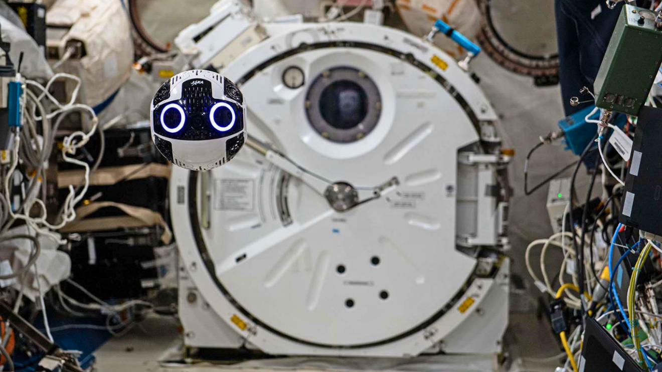 A free-flying robot through the ISS module. Credit: JAXA