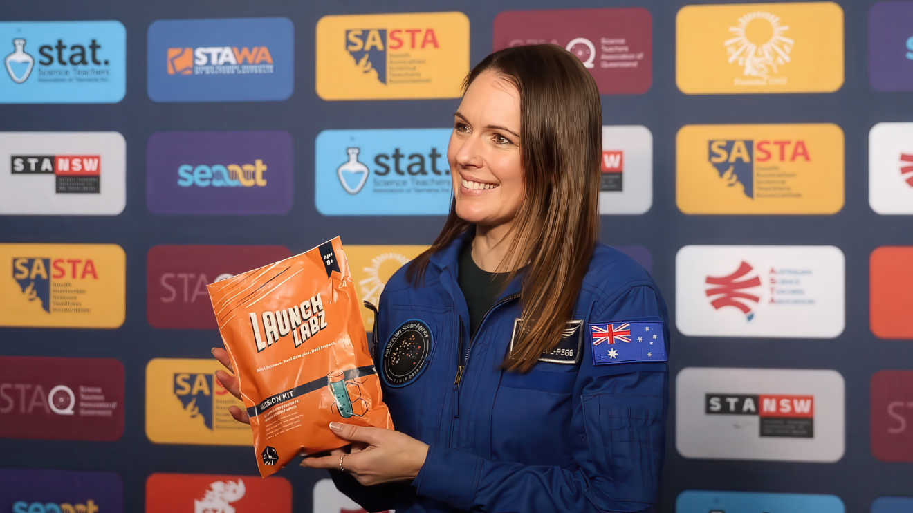 Australian astronaut and 2026 Australian of the Year Katherine Bennell-Pegg holding a Mission Sprouts kit