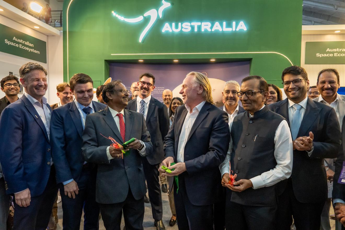 Head of Mission Phillip Green OAM opening the Team Australia Stand alongside ISRO Chairman Narayanan, and INSPACe Chairman Goenka.                                                               i.      From left to right of note: Dan Lloyd (SIAA), Dominic Shumilin (ASA), Nathan Davis (Austrade), Chairman Narayanan (ISRO), Luke Phillips (ASA), HoM Green, Chairman Goenka.