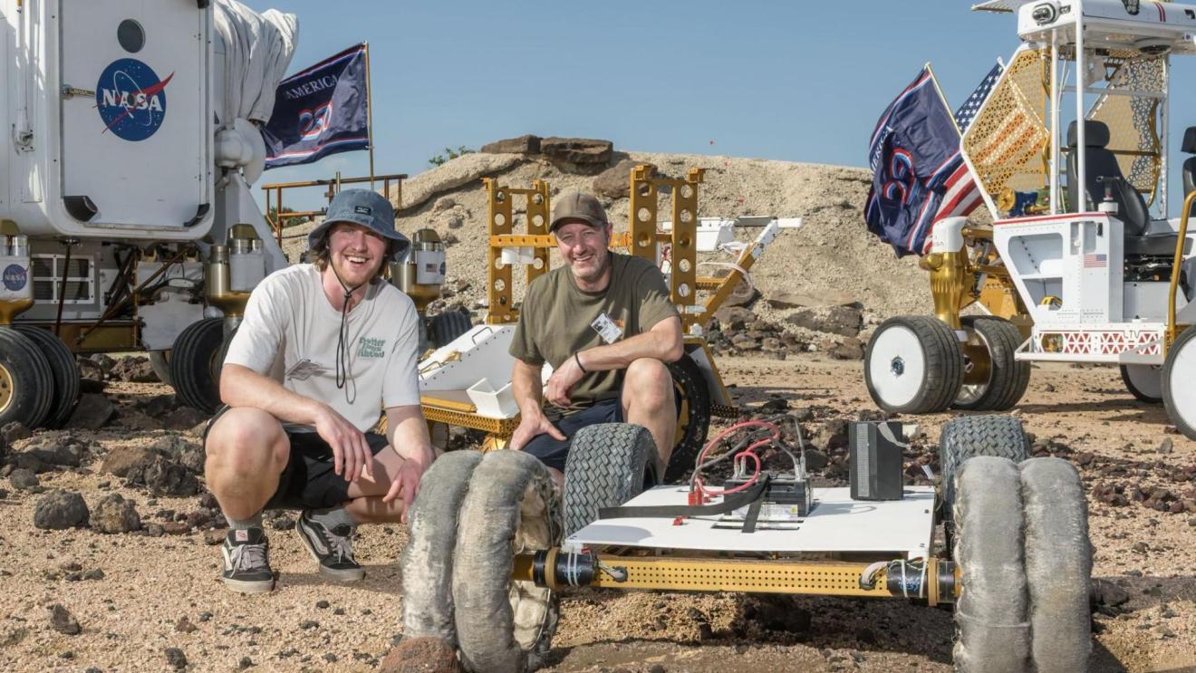 The winning Scotch Pad Tyres team poses with their prototype and MicroChariot at NASA's Johnson’s Rock Yard in Houston, US. Credit NASA/Luna Posadas Nava