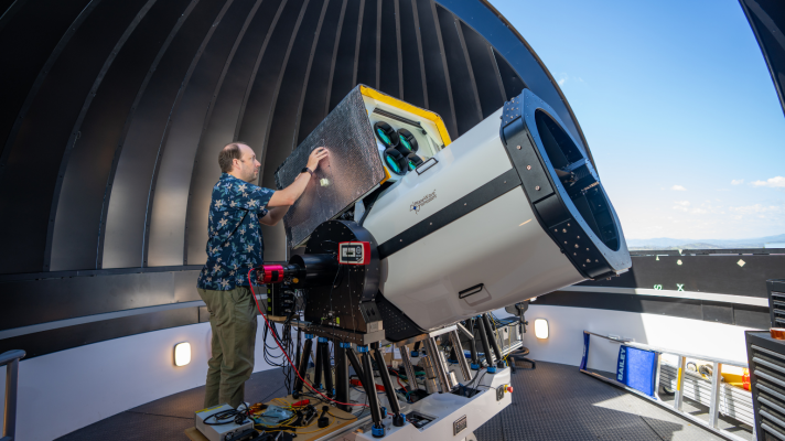 Professor Francis Bennet (pictured) with a state-of-the-art telescope at the ANU Quantum Optical Ground Station (QOGS), capable of providing space-to-ground laser communications. Photo: Nic Vevers/ANU