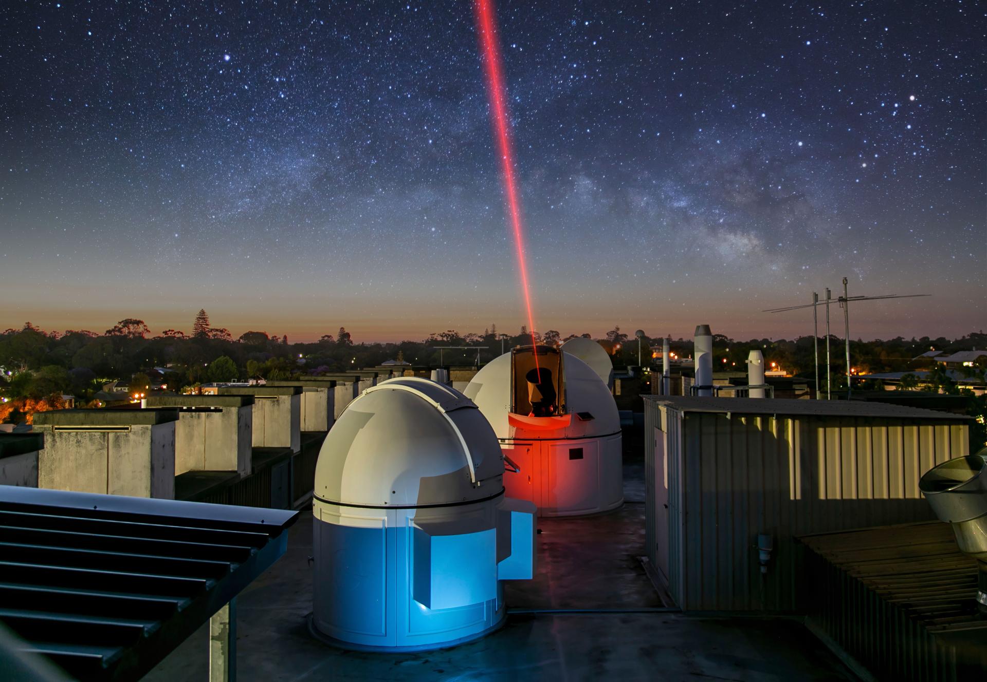 Rooftop Optical Ground Station against dark star filled sky