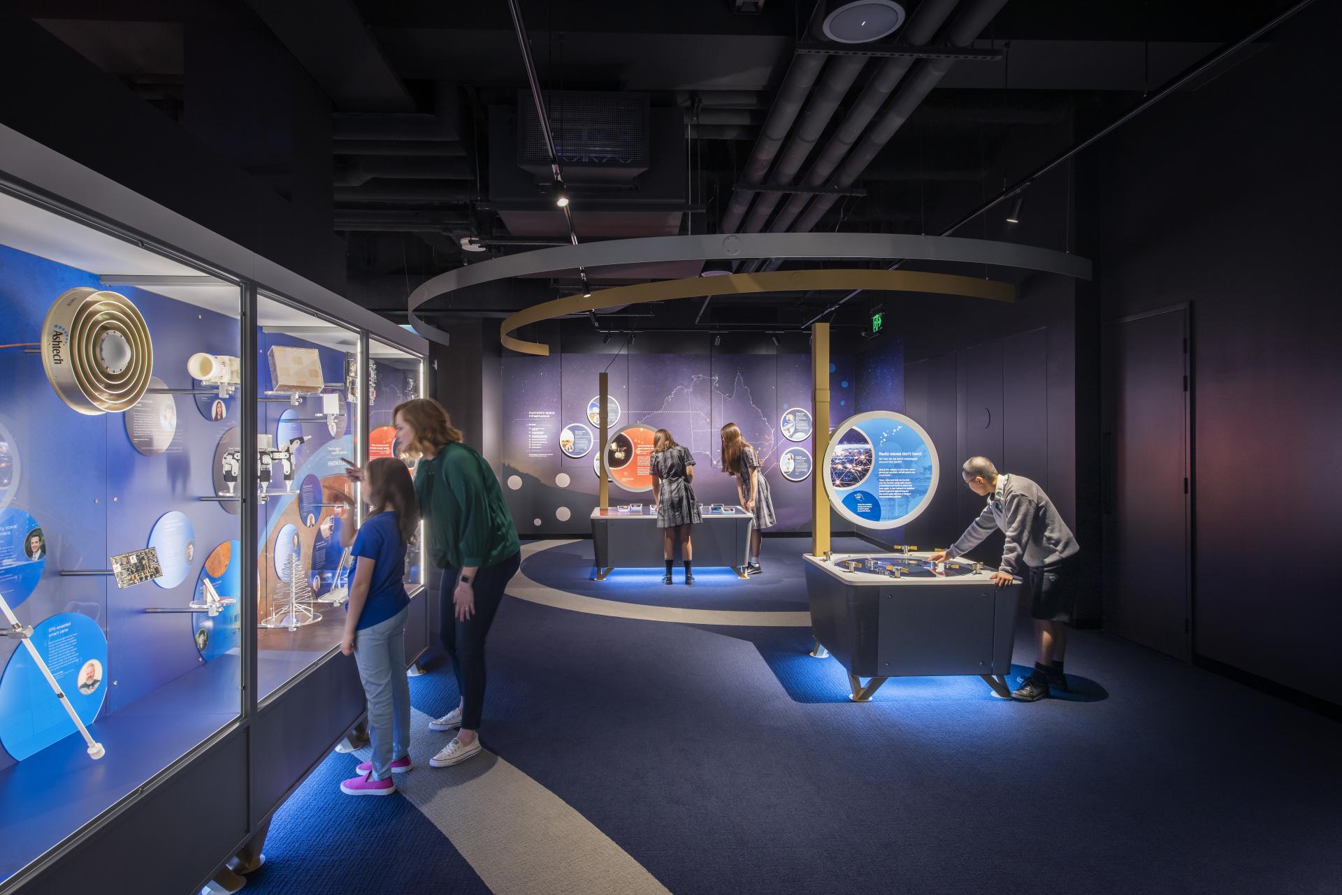 Kids interact with multiple Space exhibits and displays